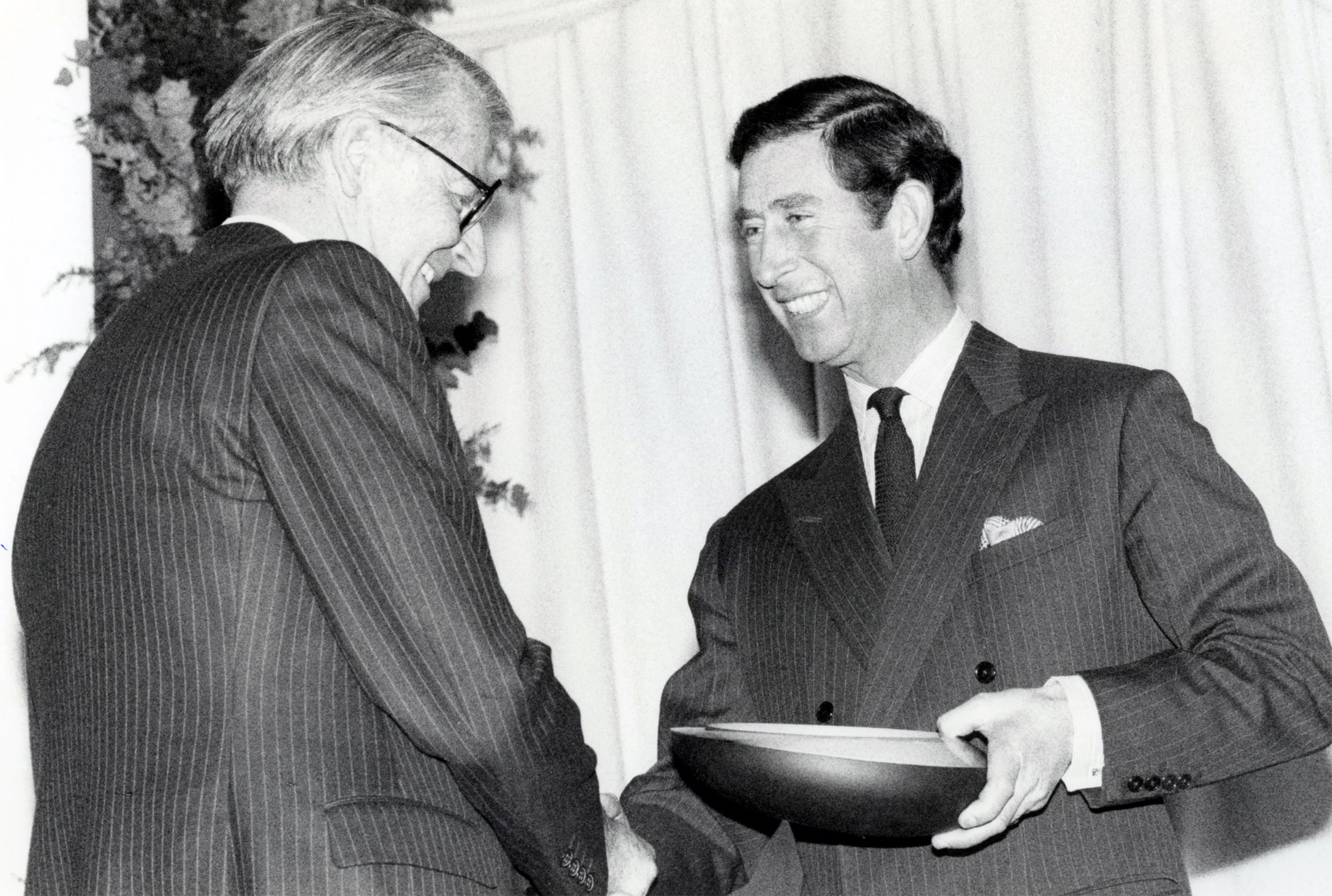The Prince of Wales presents bp chairman Sir Peter Walters with an ABSA award